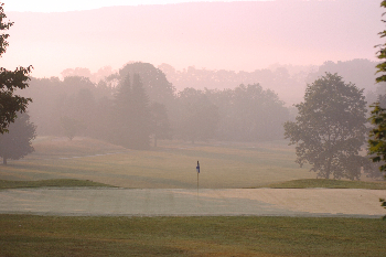 Course greens on a foggy day 